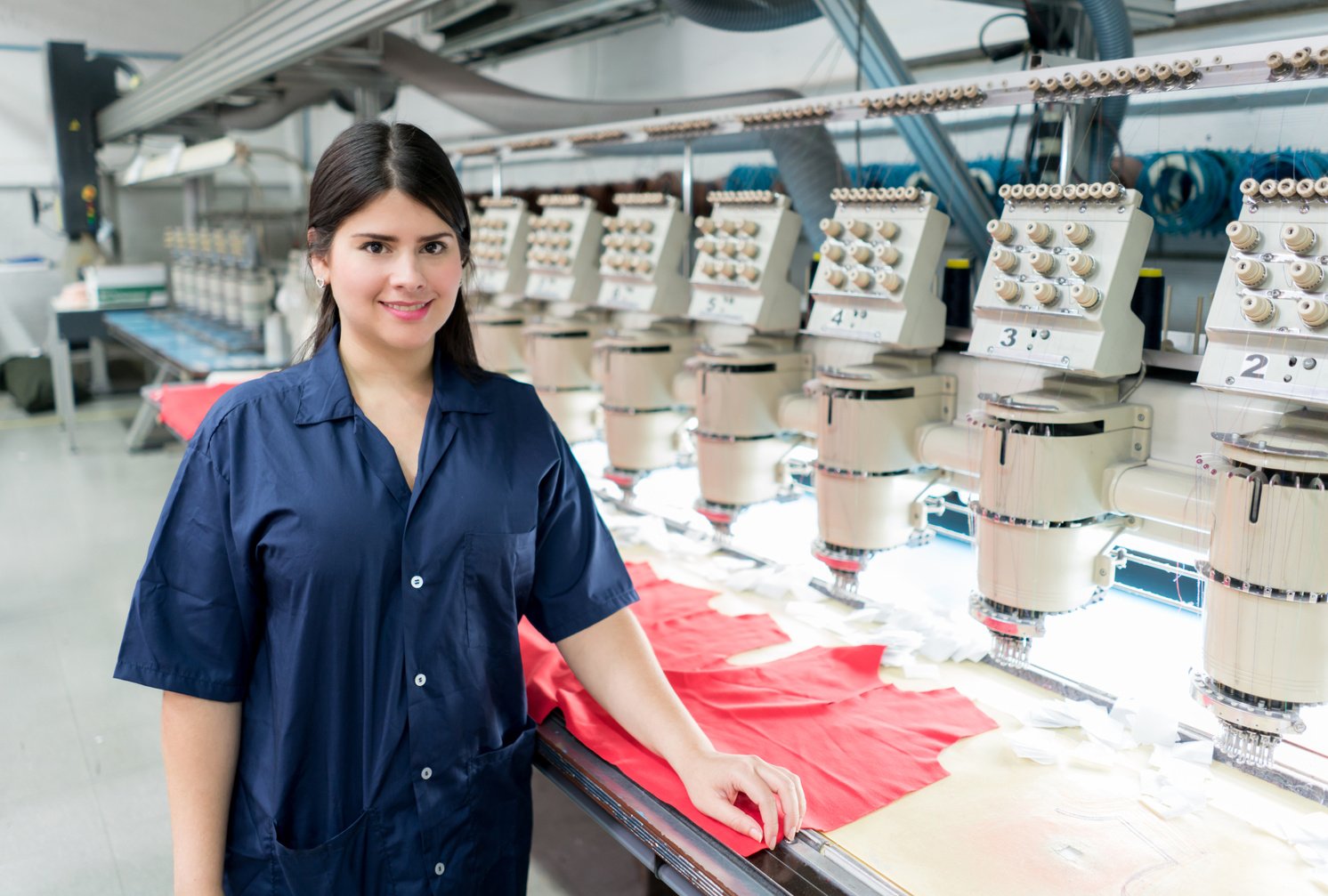 Woman operating the embroidery machine